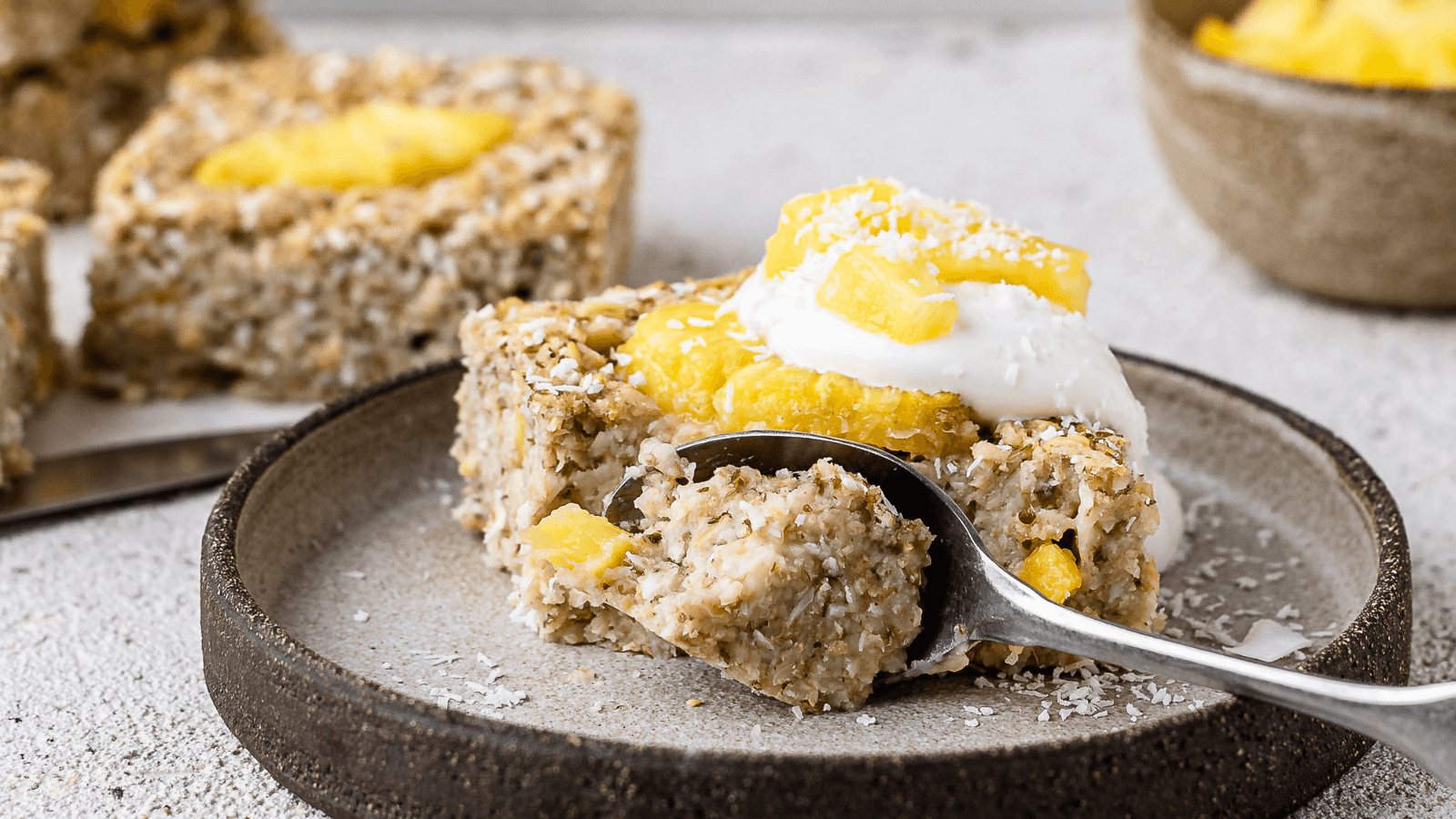 baked oats with cream and spoon