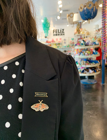 How to wear and style enamel pins