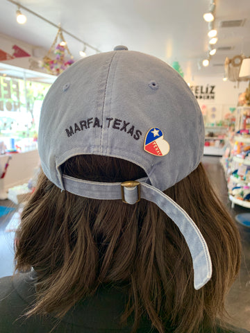 Pin styled on hat 
