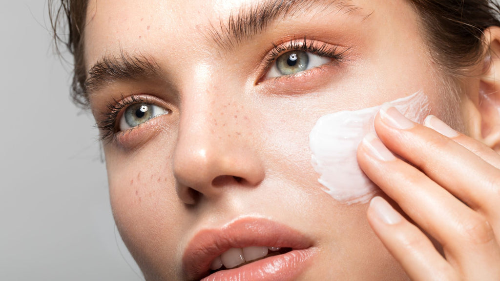 Woman applying Tailor Restore night balm made with liquorice root