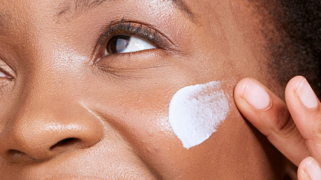 Woman applying Tailor Moisture to her skin