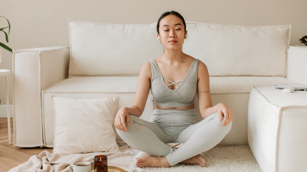 Woman doing meditation and yoga for better sleep