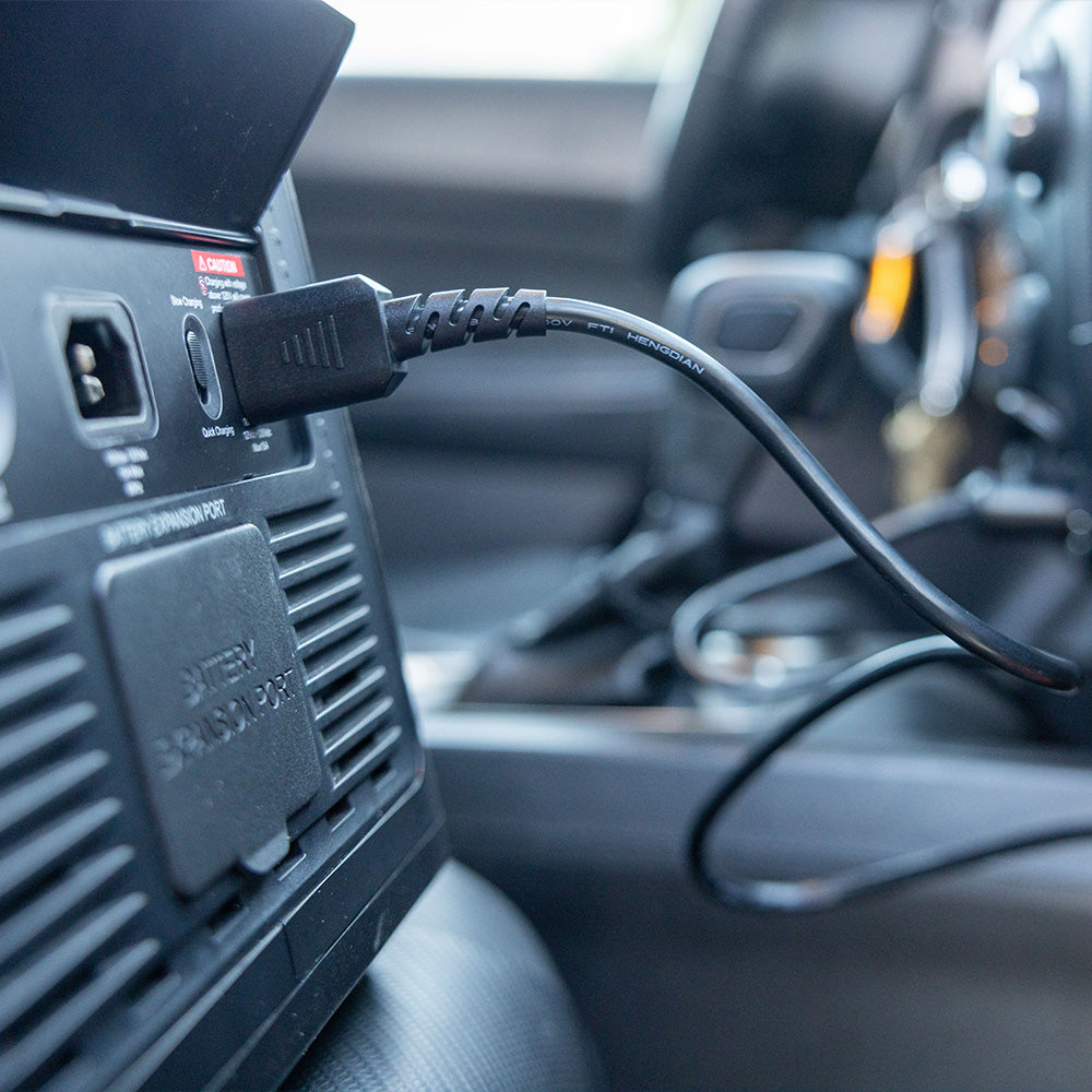 Photo of the 2200 battery being charged in a car.