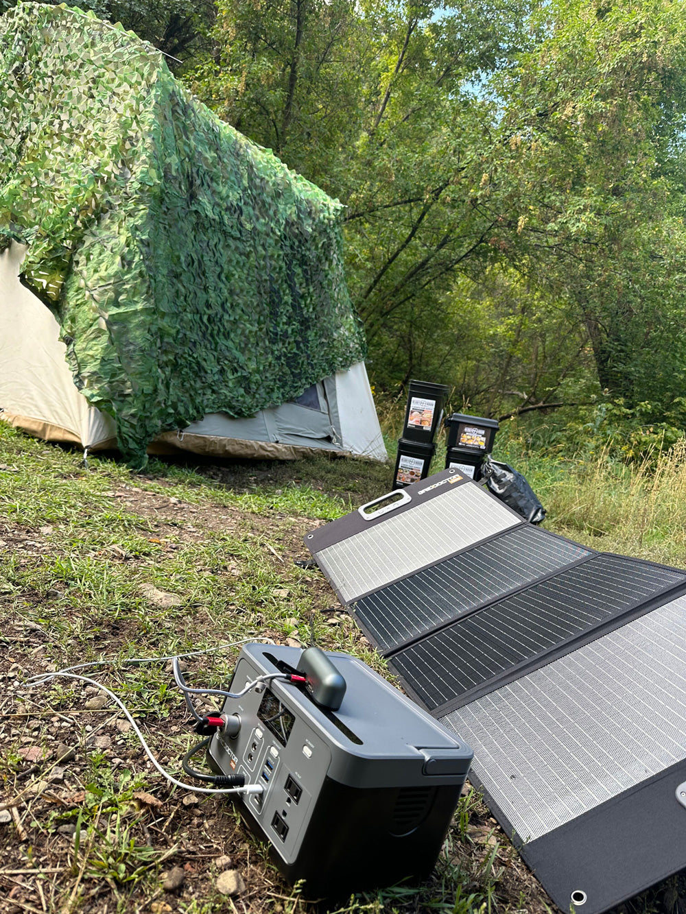 Photo of Grid Doctor solar panels being used at a campsite.