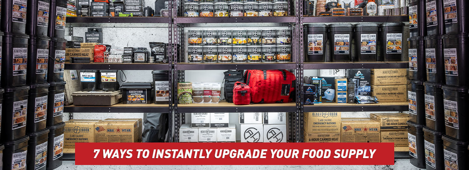 A wide, open room with shelves loaded with black buckets of emergency food.