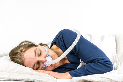 woman sleeping with a cpap