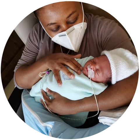 Father's Nursing Assistant wearable nursing device, This device allows  fathers to breastfeed their babies. Father's Nursing Assistant is a  wearable tank in the shape of a woman's breast that allows