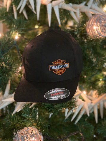 THIGHBRUSH® BIKERS - "THIGHBRUSH APPAREL COMPANY” - FlexFit Hat in Black with THIGHBRUSH® Apparel Logo on the Left Front. Available in Sizes Small/Medium and Large/X-Large.