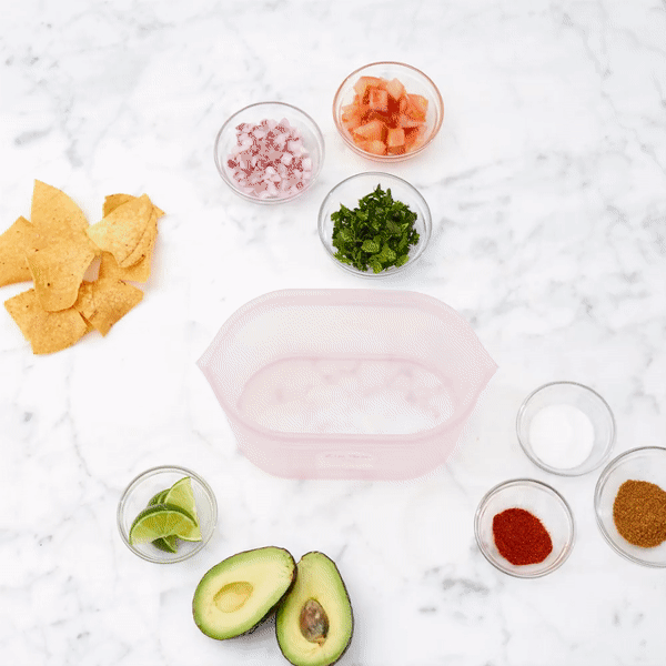 Making guacamole in a reusable silicone container gif