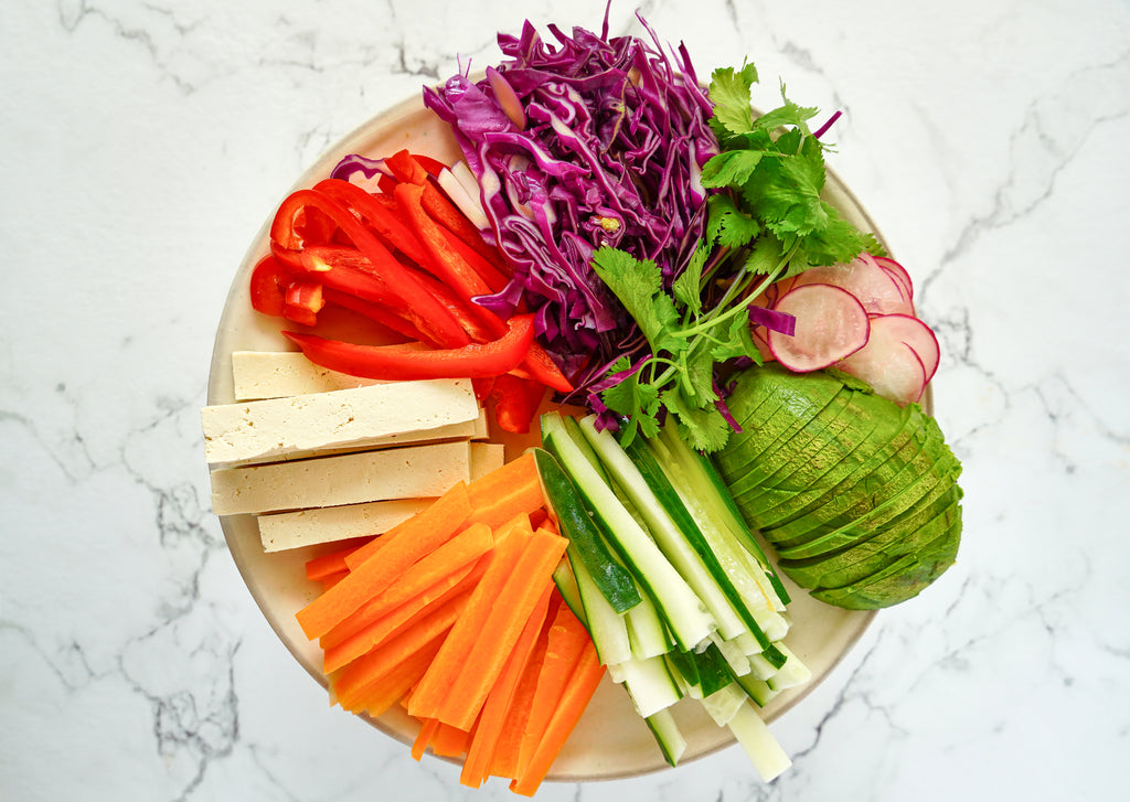 Vegan spring rolls veggies overhead closeup on a plate