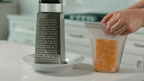 Grating cheese and storing in Zip Top reusable silicone container