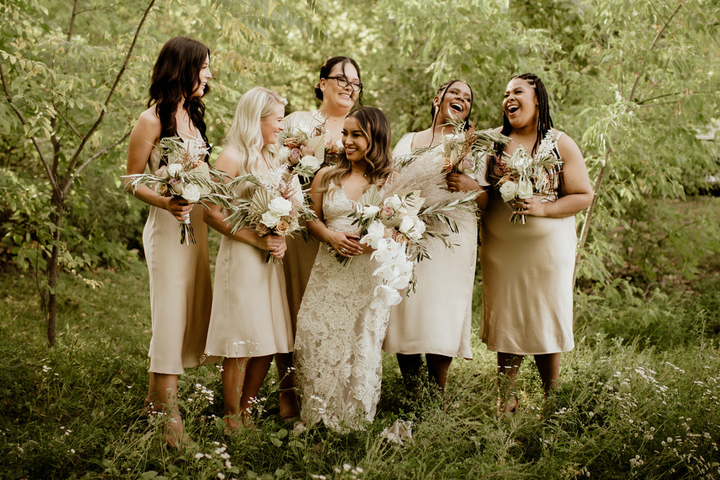 nude and gold bridal party with bride in elegant lace sheath gown