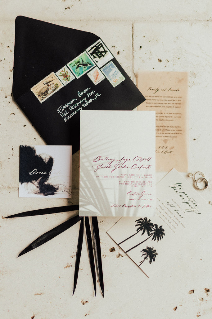 black and white palm tree travel themed wedding invitation suite