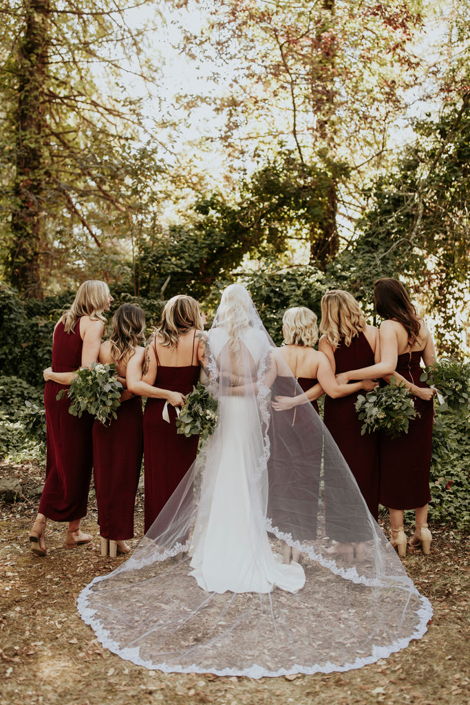 mantilla cathedral length bridal veil with scallop French lace and bridesmaids in wine dresses