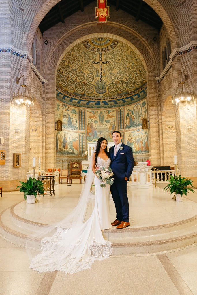 christian church orthodox wedding with long beaded scattered rhinestones bridal veil and scalloped train dress