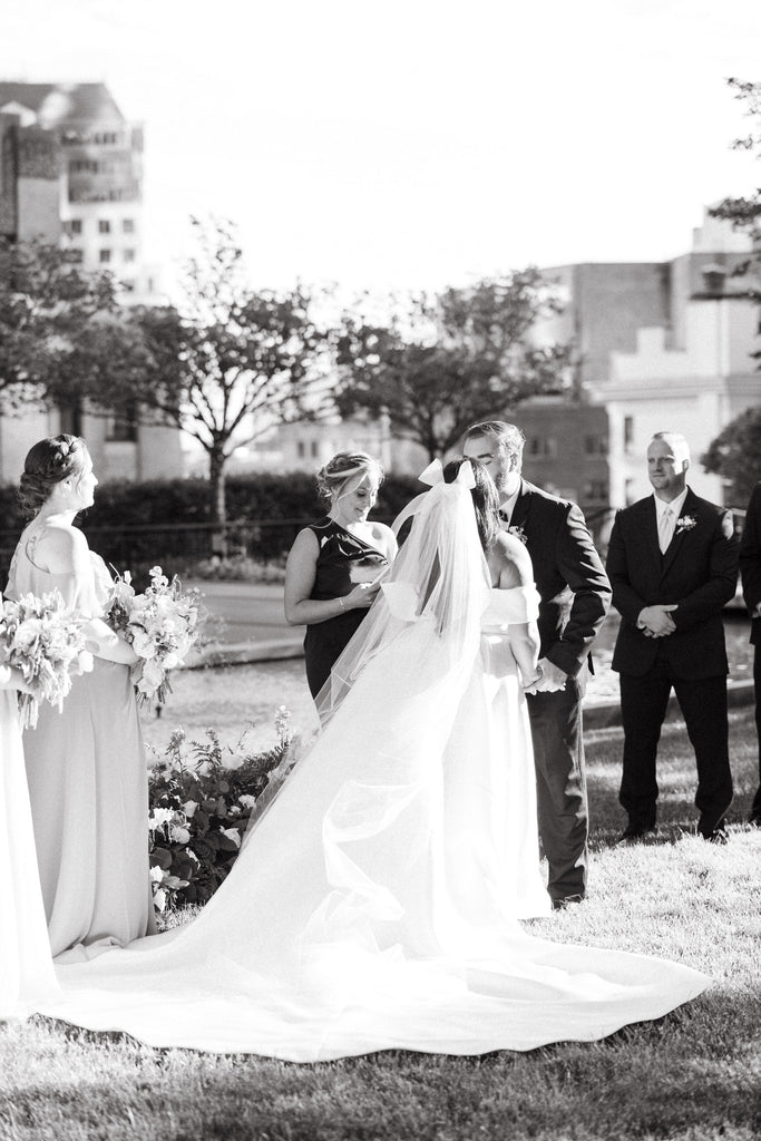 bow wedding veil with ballgown dress for downtown city park wedding