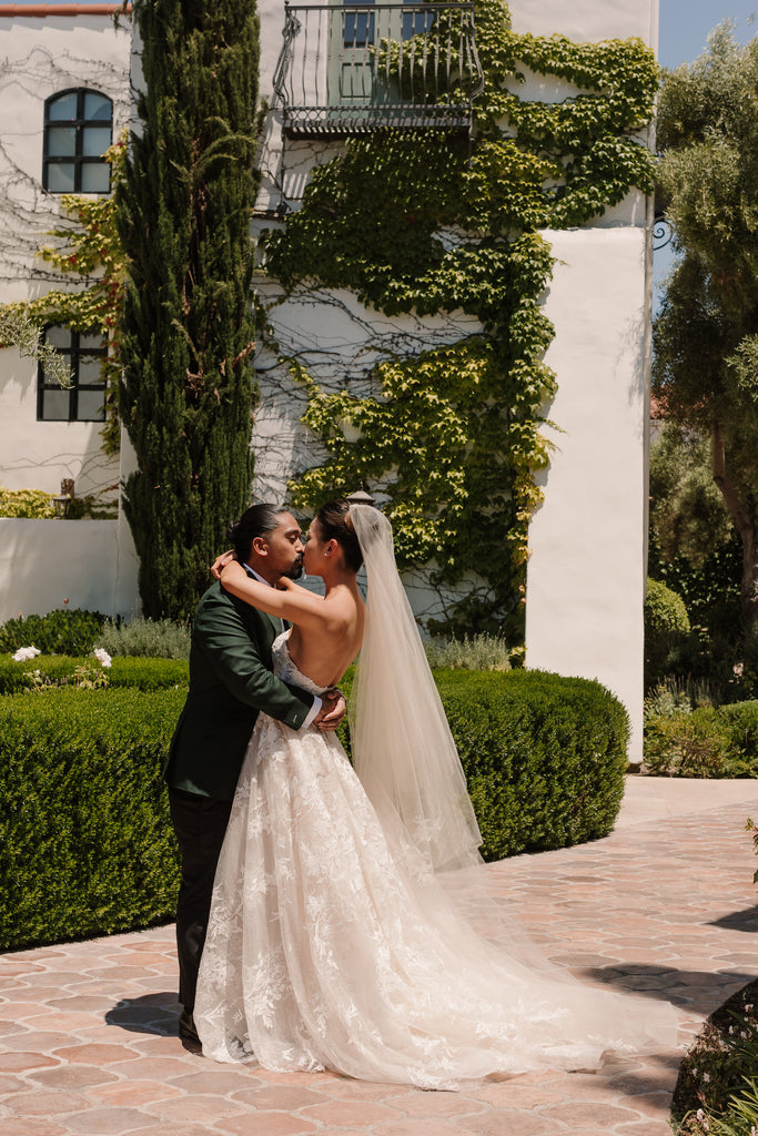 outdoor estate wedding with bride wearing blush cathedral wedding veil