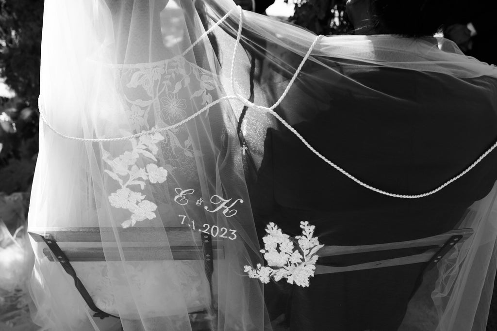 unity veil with cords over couple's shoulder for traditional catholic ceremony