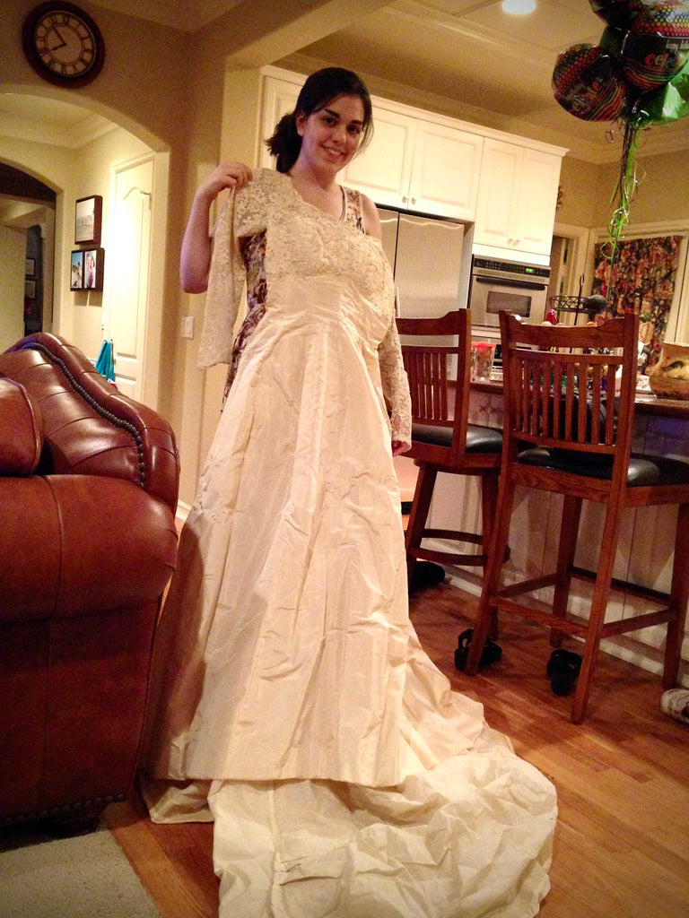 repurposing vintage wedding dress into new bridal accessory of bride