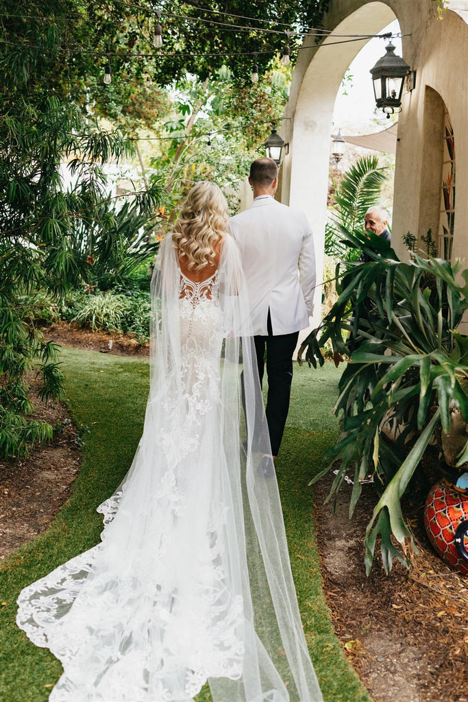 warm garden hacienda wedding for glam bride in lace dress and wing shoulder wrap