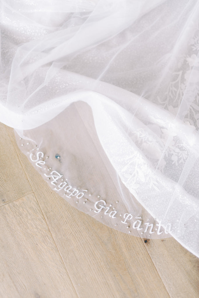 white cathedral bridal veil with script embroidery and pearls and beading