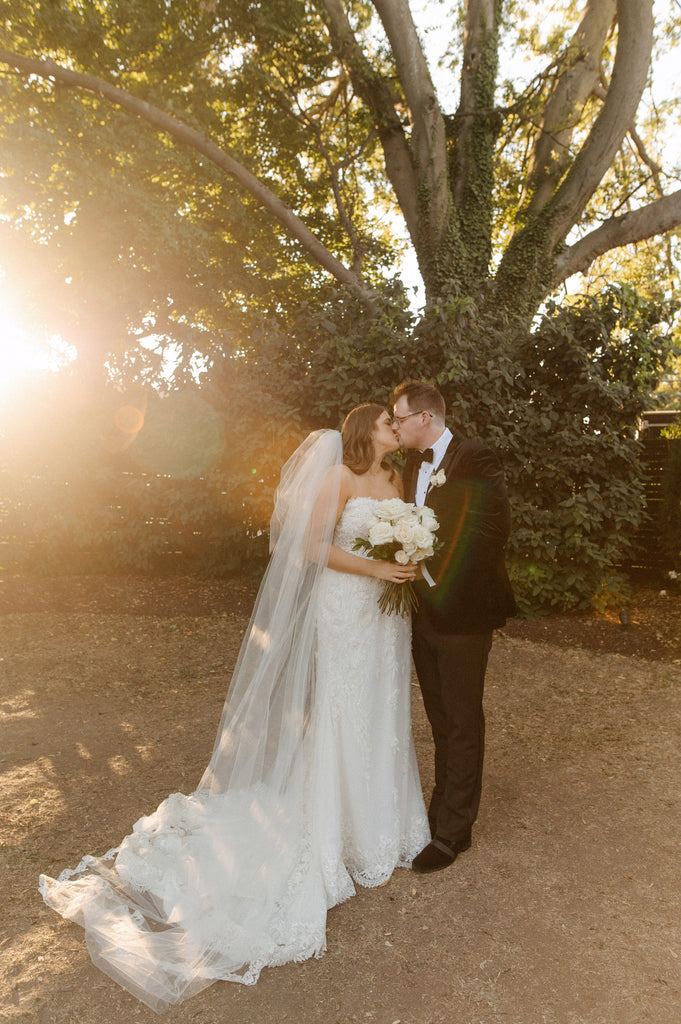 curvy bride in strapless sweetheart neckline gown and extra full puffy long wedding veil