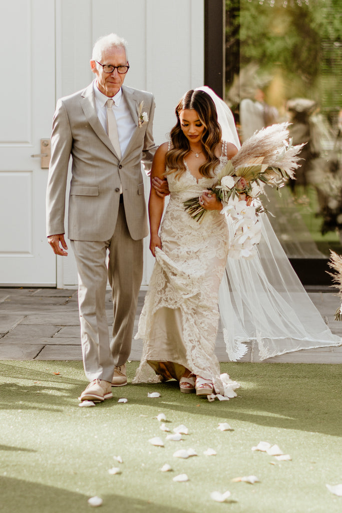 bride and Dad walking down aisle with bride in lace long bridal veil