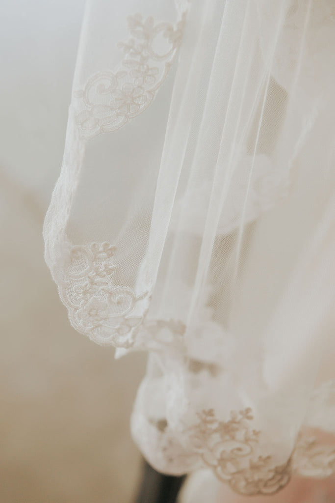 French Alencon lace trimmed fingertip length bridal veil