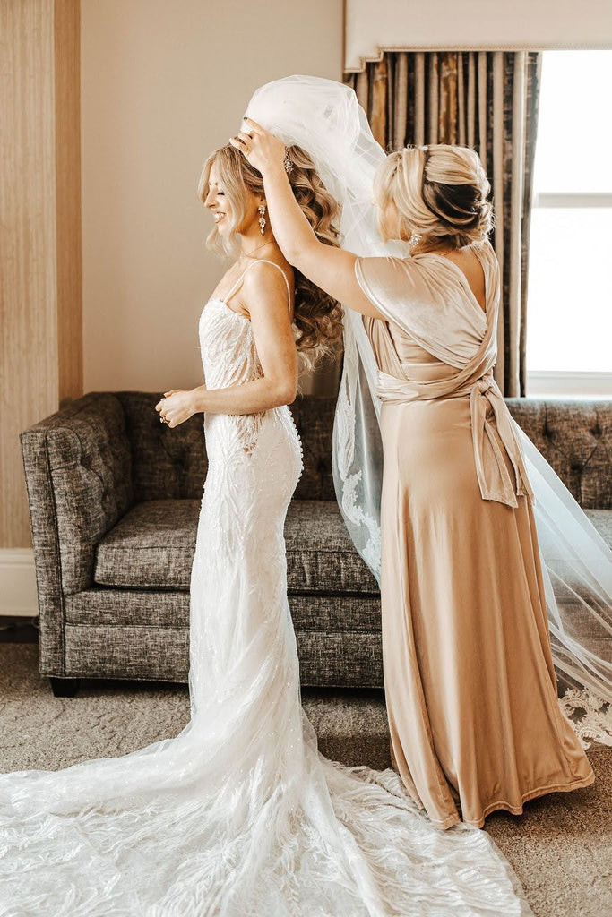 elegant long cathedral bridal veil over bride's high curly ponytail