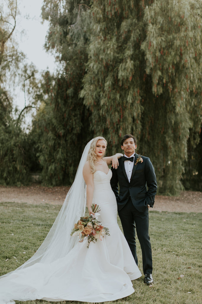 autumn forest wedding with rustic tones and bride wearing full extra puffy cathedral wedding veil with ivory lace trim