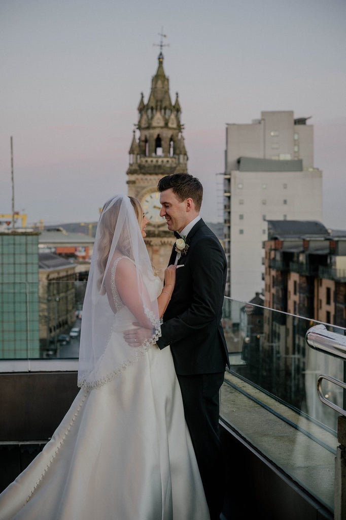 organza fingertip length bridal veil with silver sparkly embroidered edge on bride in London