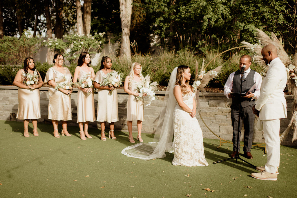 gold and nude outdoor wedding ceremony for large wedding