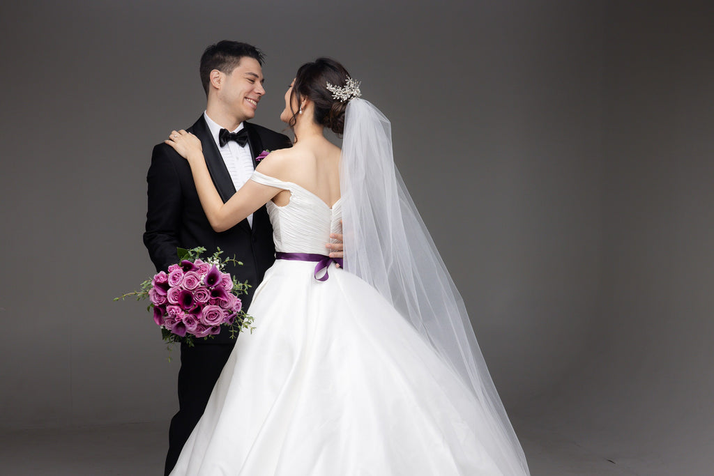 sparkly beaded pearl hairpiece attached to long bridal cathedral veil in updo