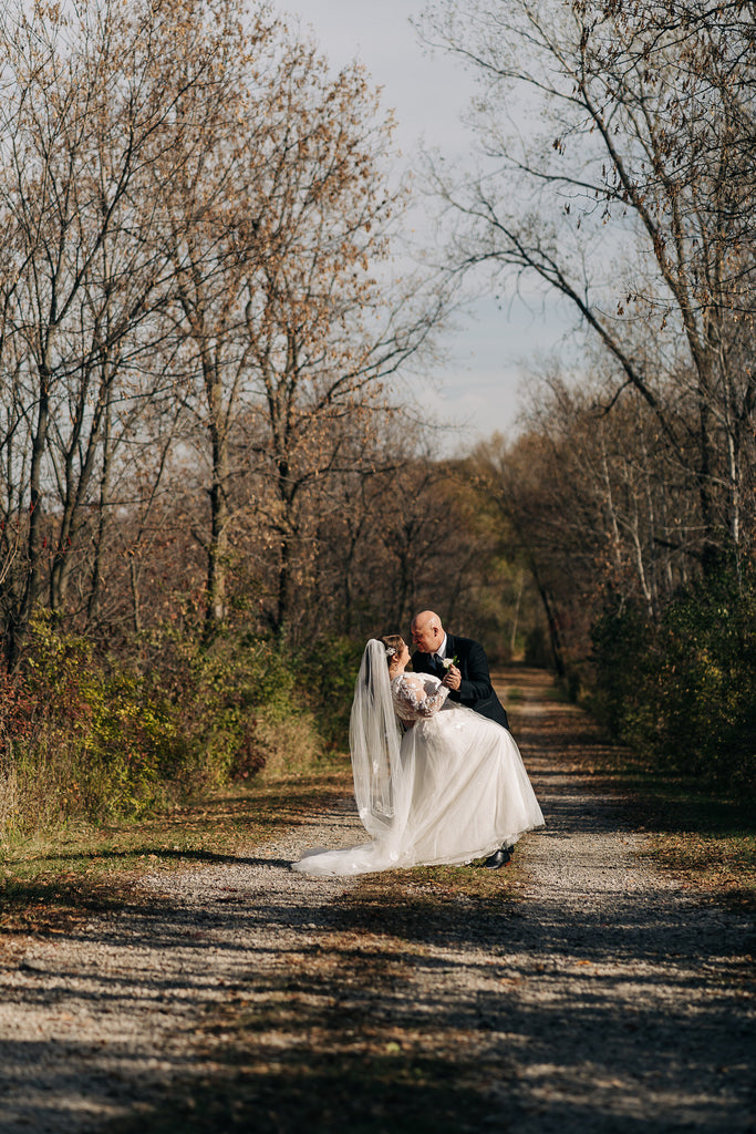 autumn outdoor trail wedding with long floor length lace applique bridal veil in off white