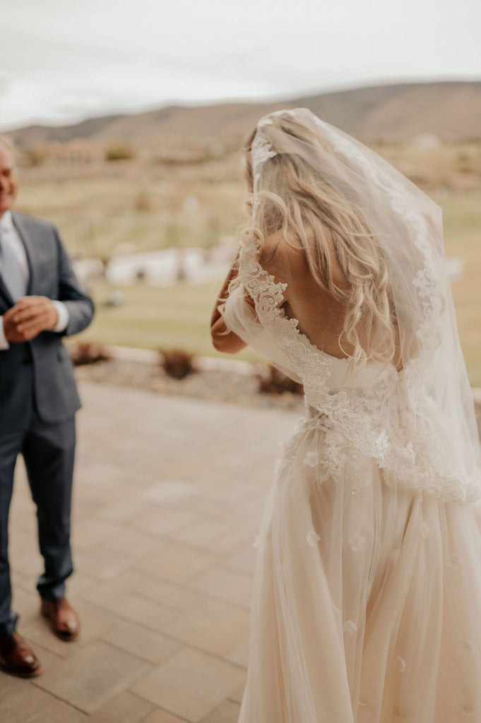 French lace mantilla wedding veil on bride wearing whimsical ethereal 3D soft A line gown