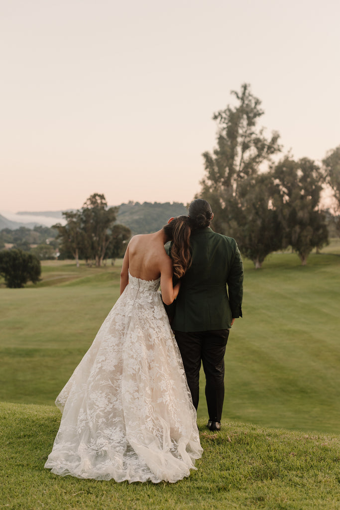 bridal ponytail with waves for classic blush bridal gown for summer outdoor wedding