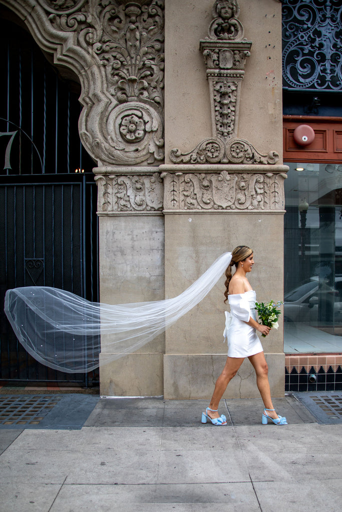 courthouse wedding with short cocktail dress and long horsehair edge ivory bridal veil