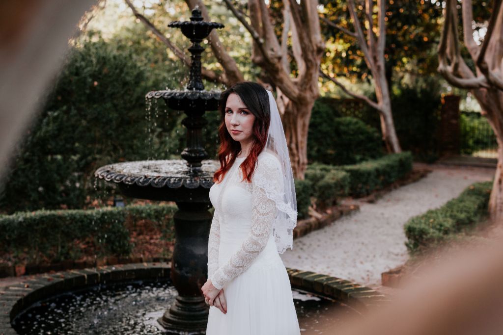 moody vintage chic wedding inspiration with long sleeved dress and elbow length veil