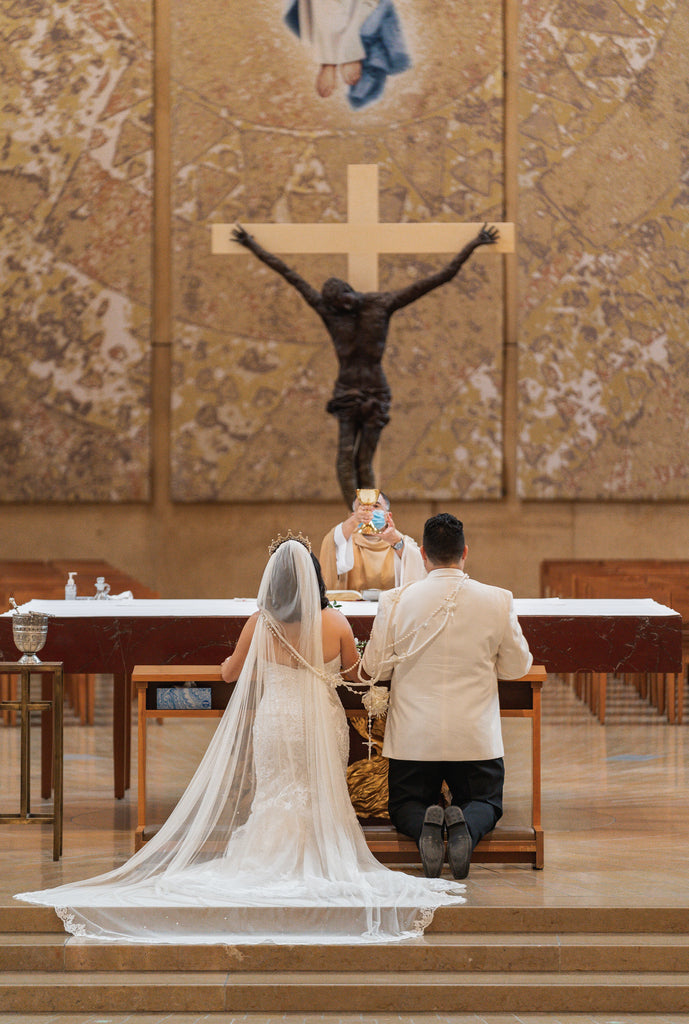 form fitting strapless gown for catholic wedding with English net bridal veil