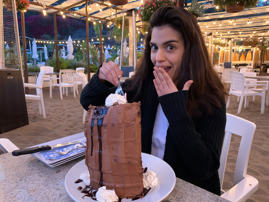 bridal veil designer eating chocolate cake