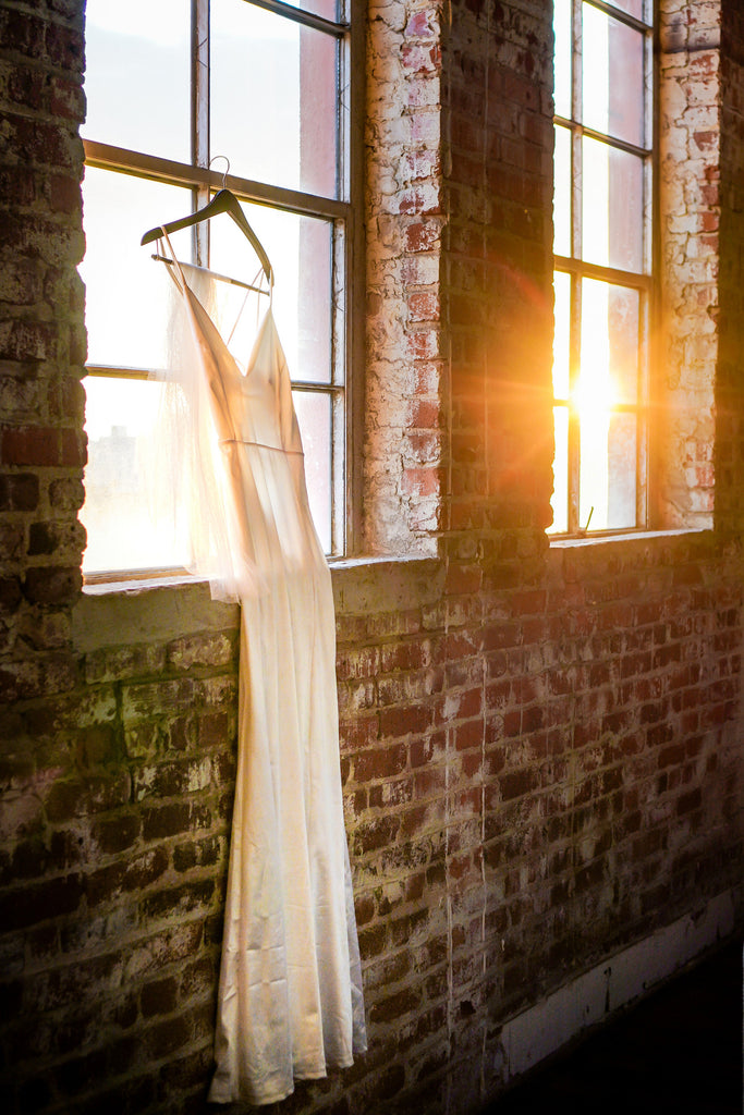 elegant simple sheath bridal gown with polka dot Swiss dot fingertip length veil
