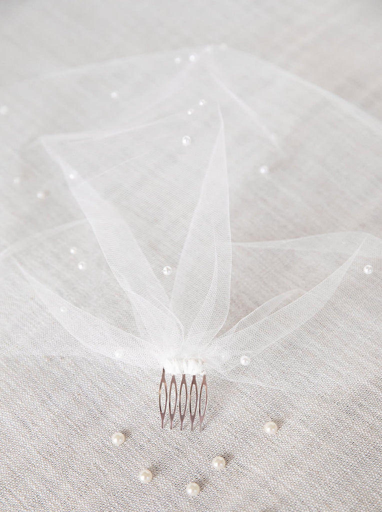 small slim metal hair comb attached to short blusher bridal veil