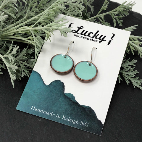 enameled penny earrings on card