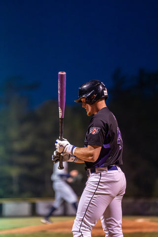 Image shows a player stepping up to the plate with Bruce Bolt gloves on.