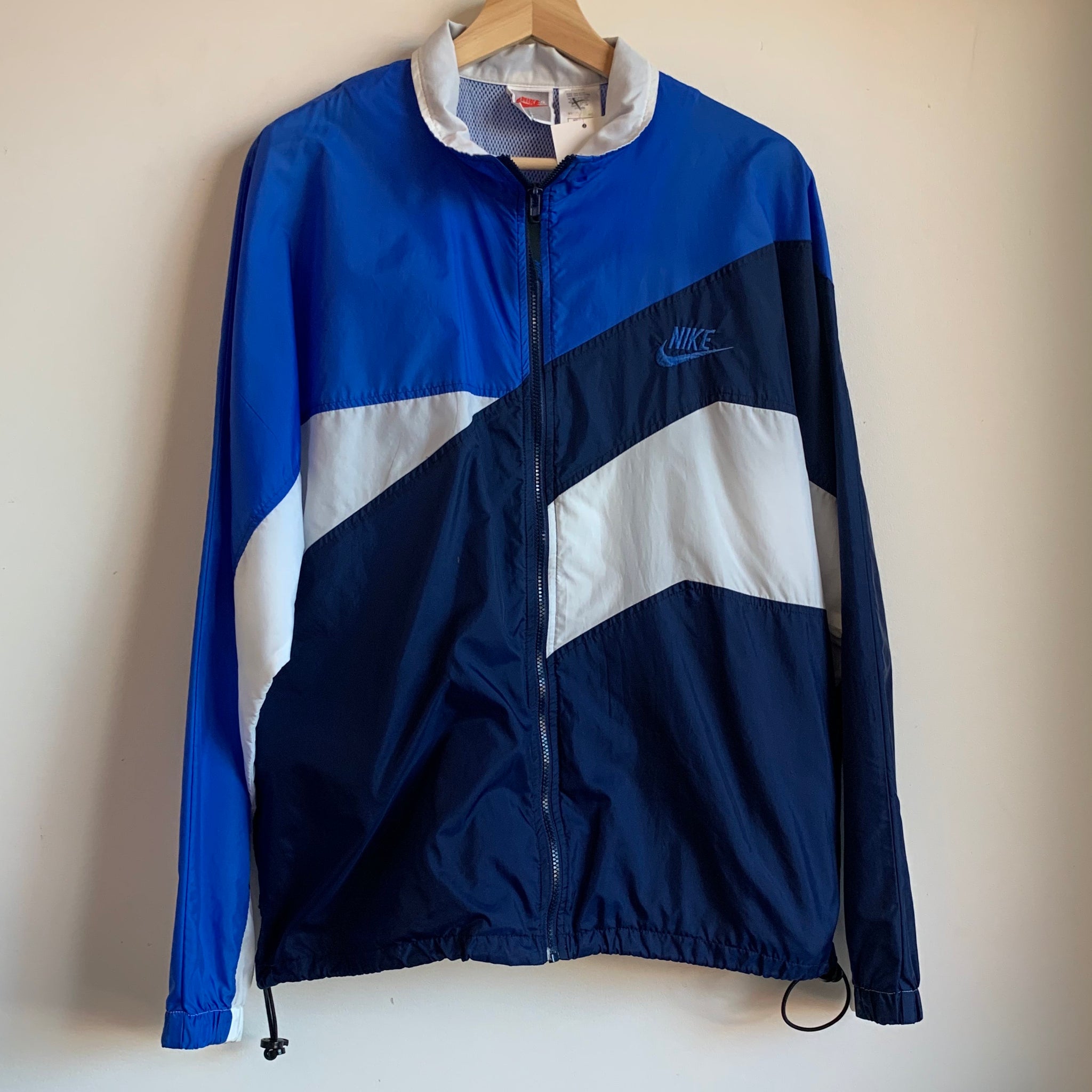 blue and white nike windbreaker