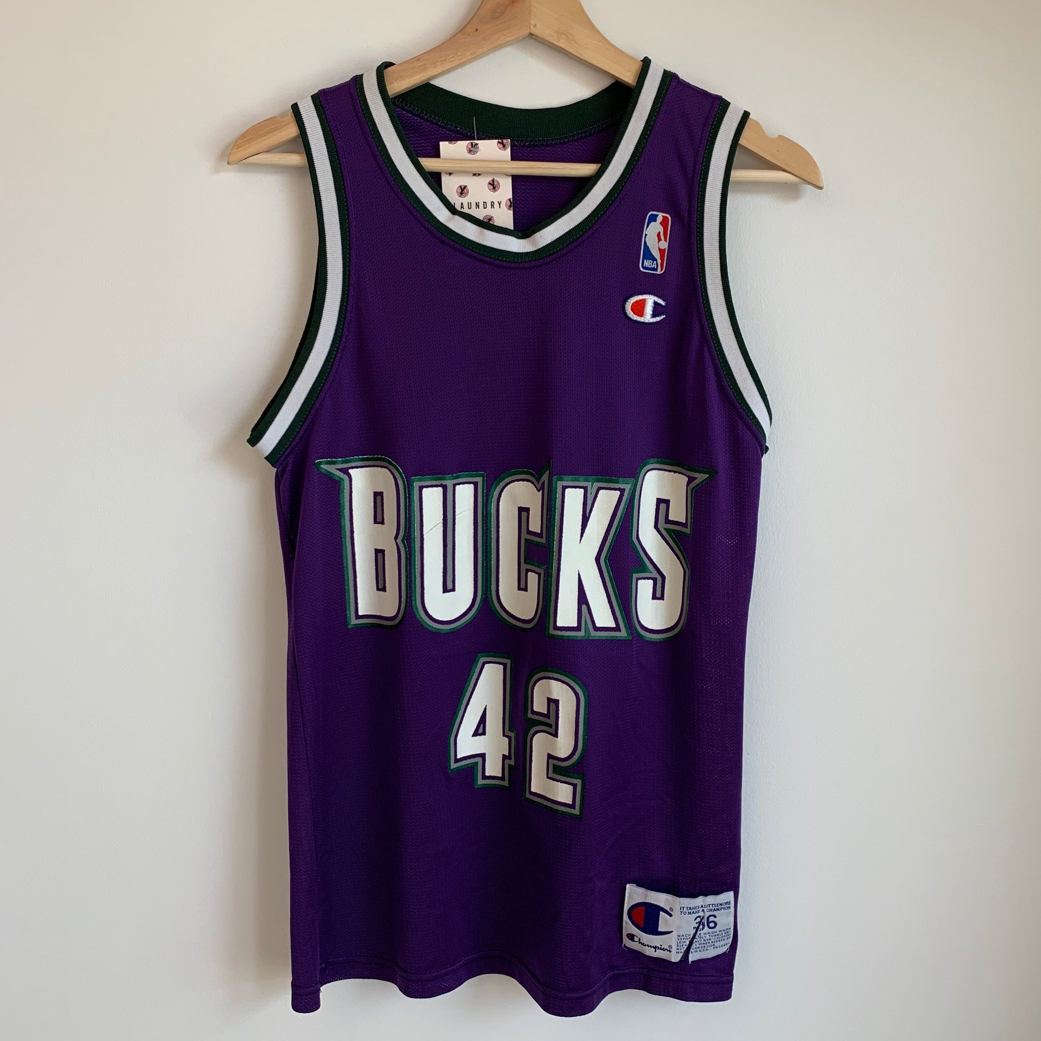 purple and white lakers jersey