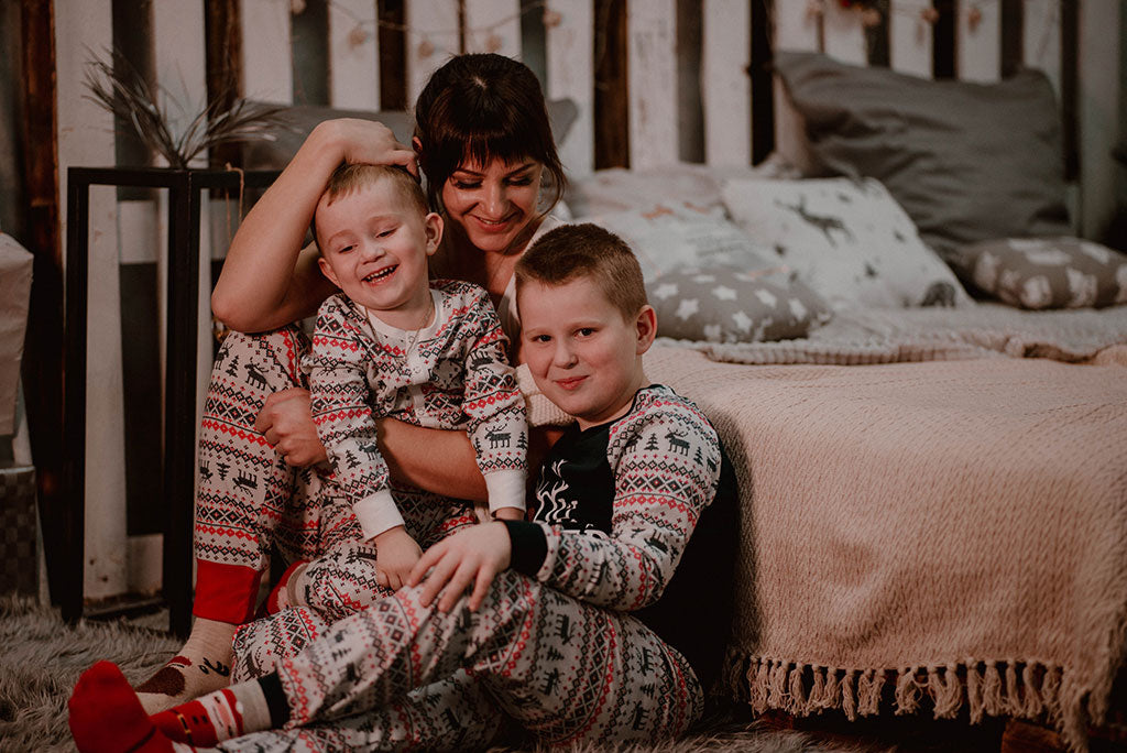 wearing matching christmas pajamas, family holiday traditions to start with kids
