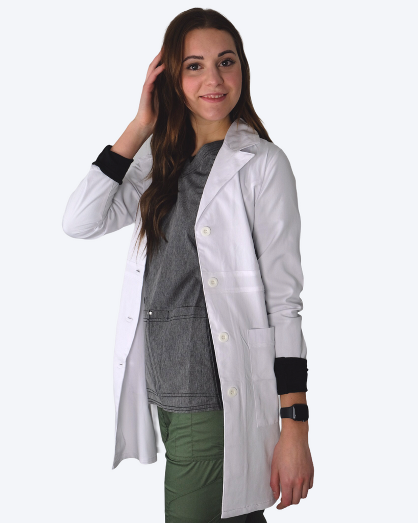 Healthcare worker wearing white lab coat and scrubs