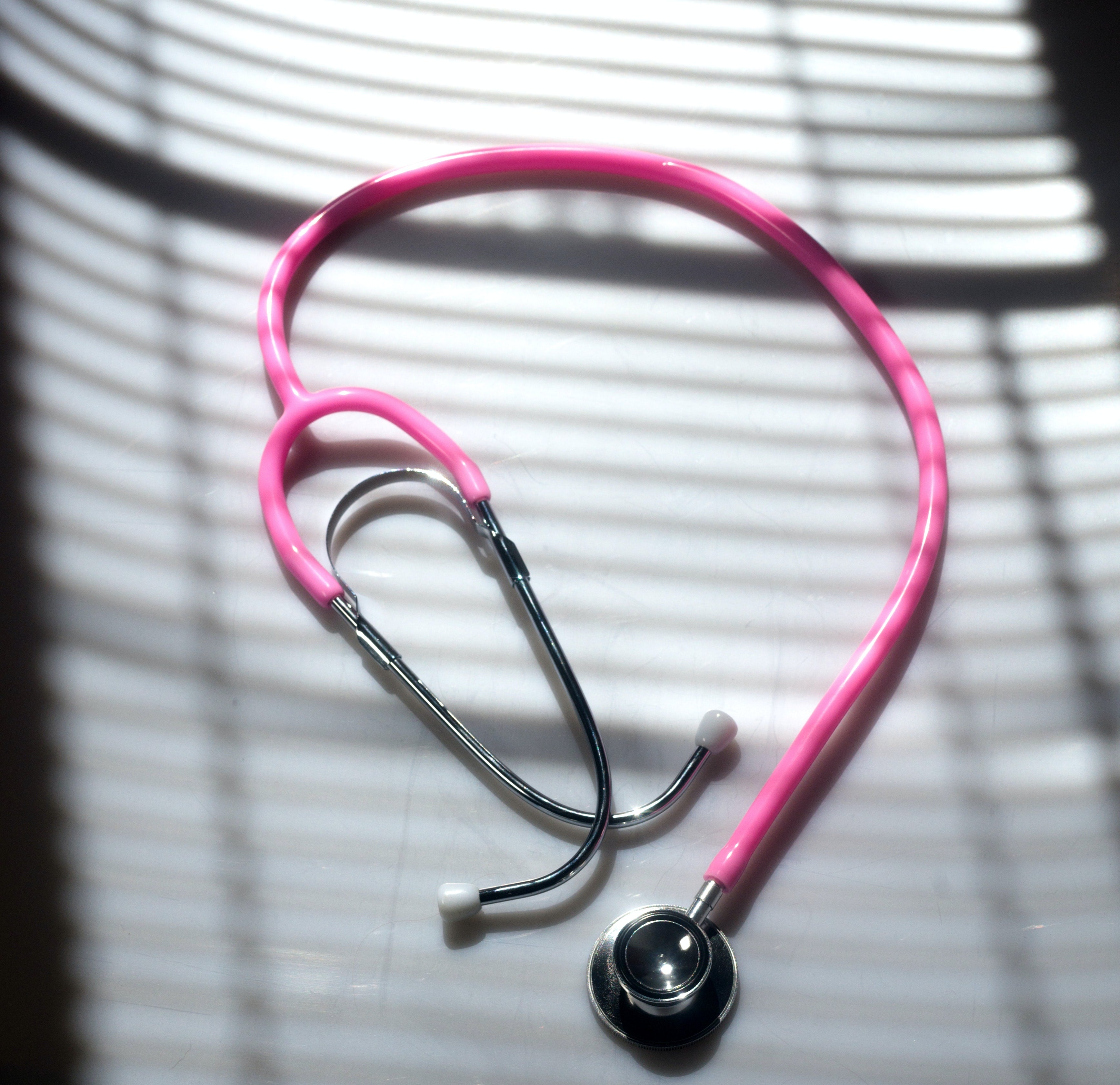 Pink stethoscope for clinical practicum experience in nursing school