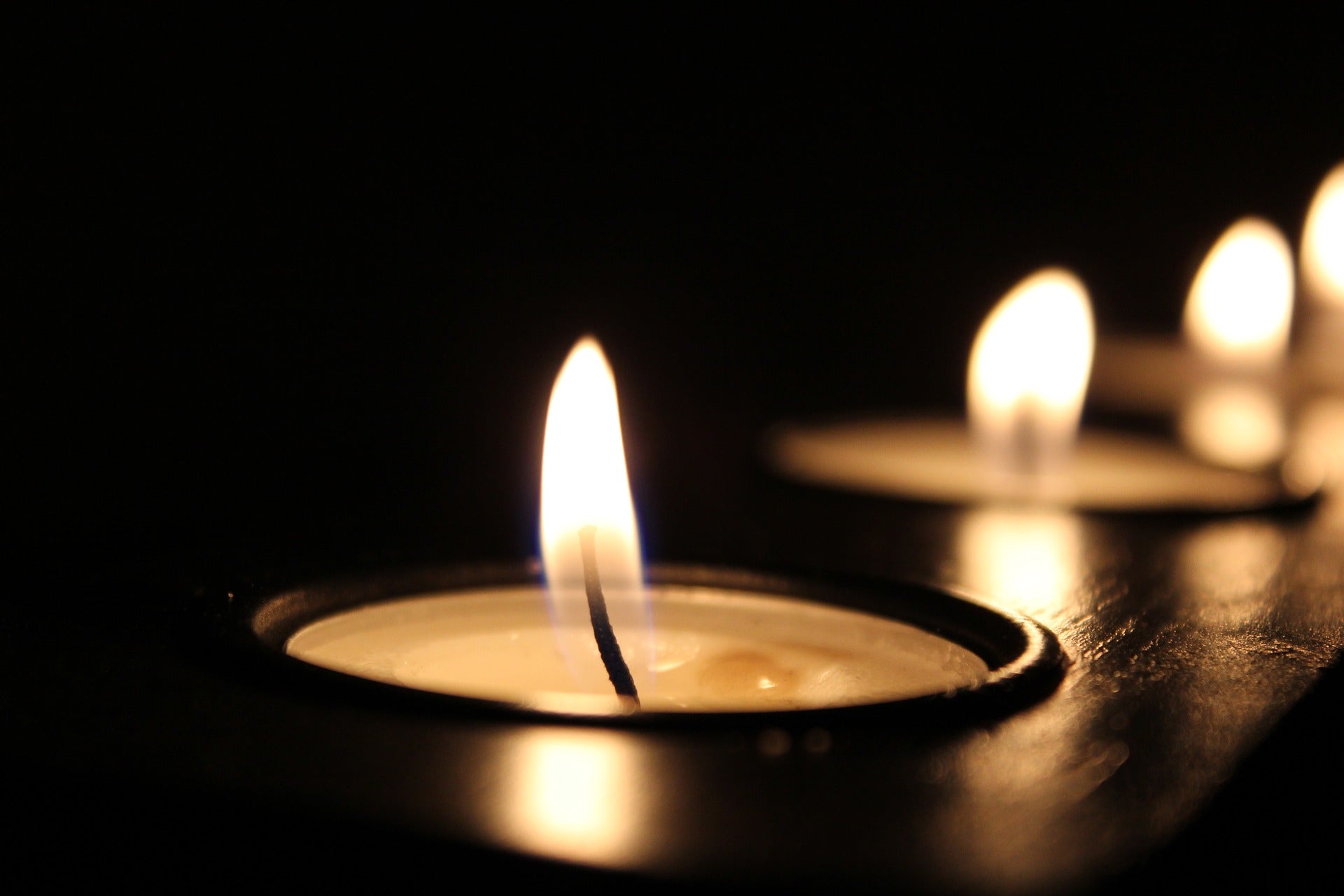 Candles burning with dark background 